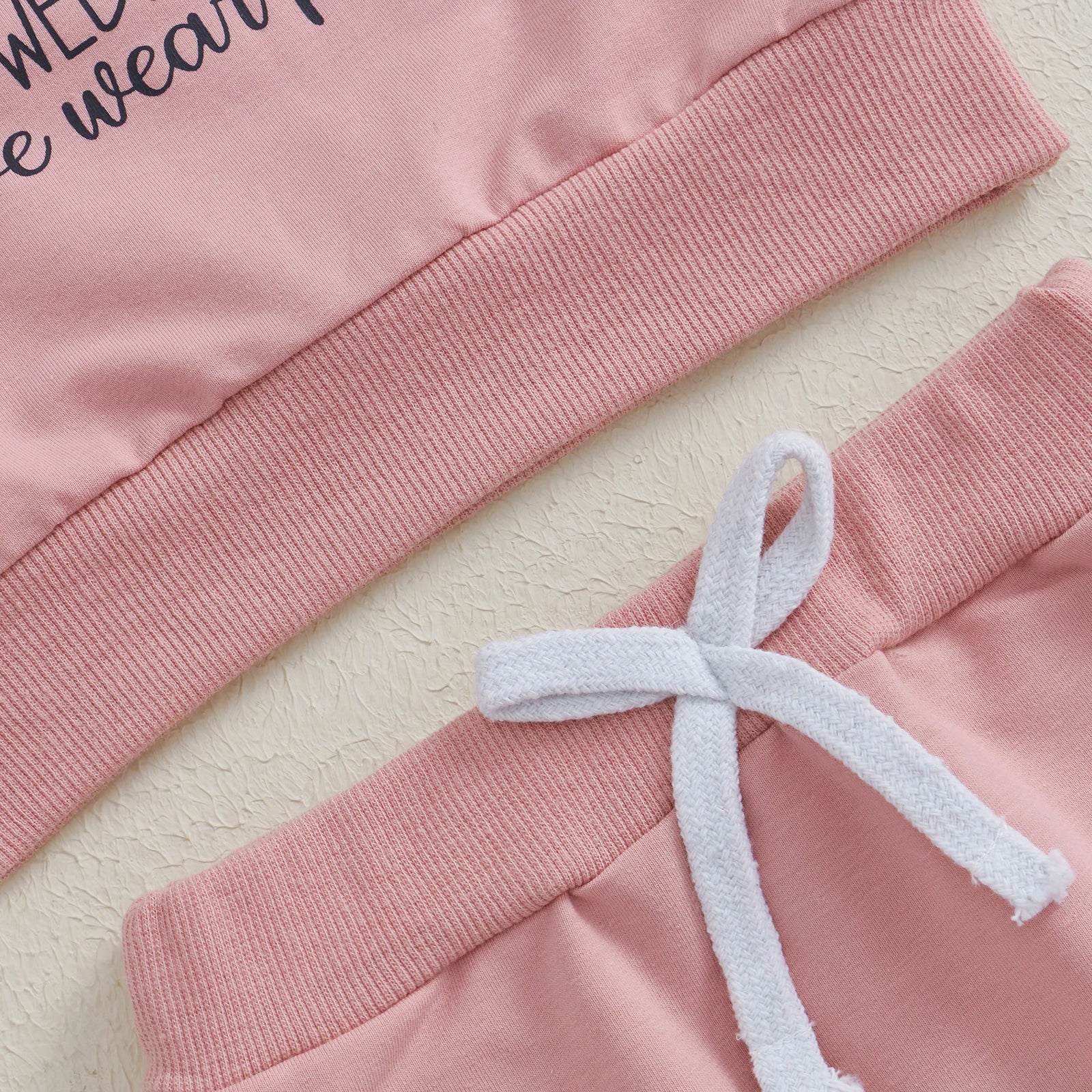 On Wednesday's We Wear Pink Tracksuit